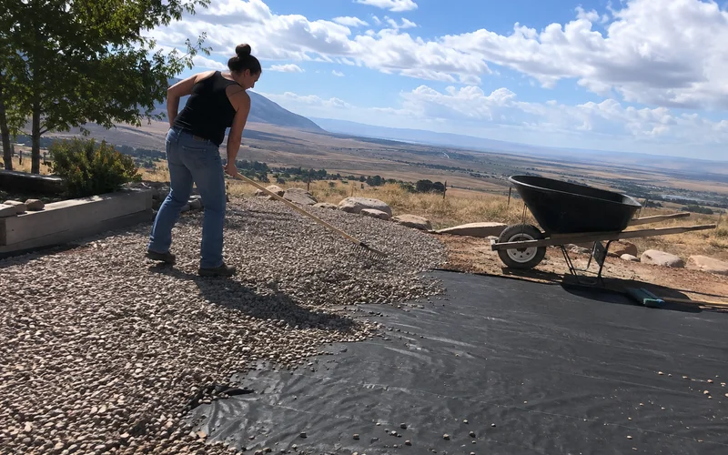 Geotextile weed fabric being covered with decorative gravel