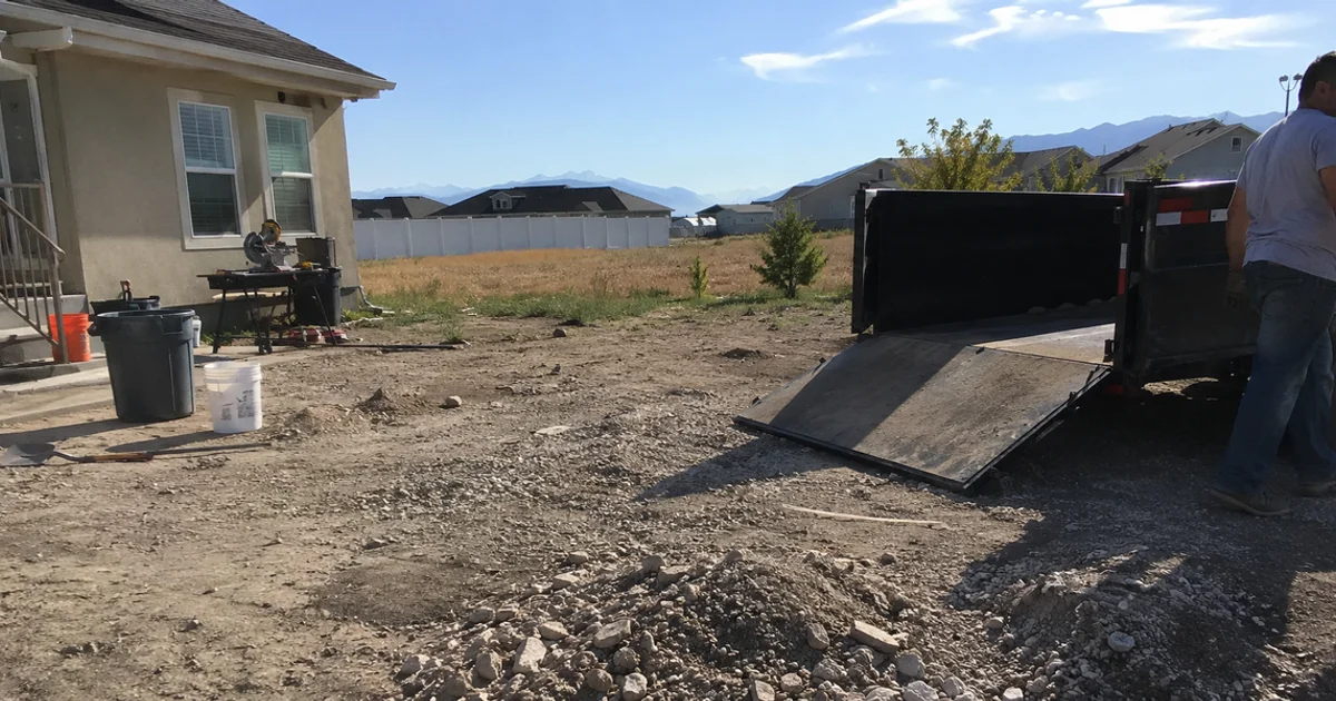 Rocky, compacted builder dirt in a new Utah yard before soil preparation