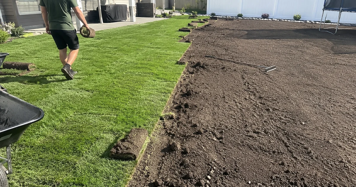 A Utah yard half laid in fresh sod and half freshly seeded, showing the contrast