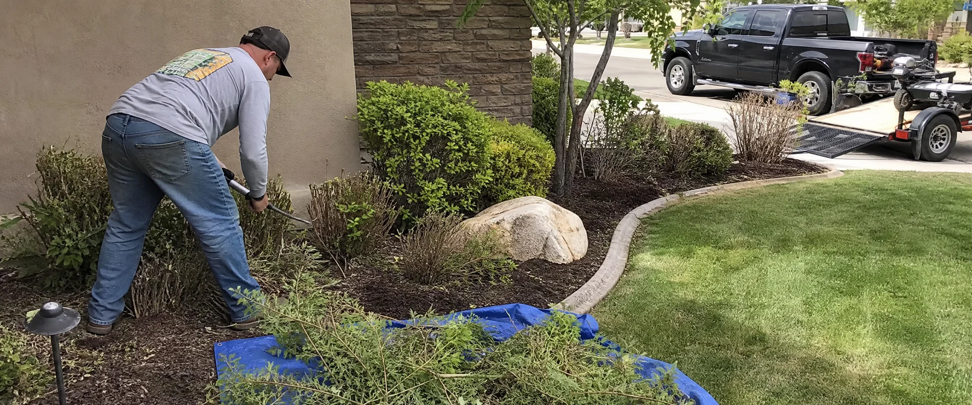YLC Landscaping crew completing landscape maintenance on a Utah property