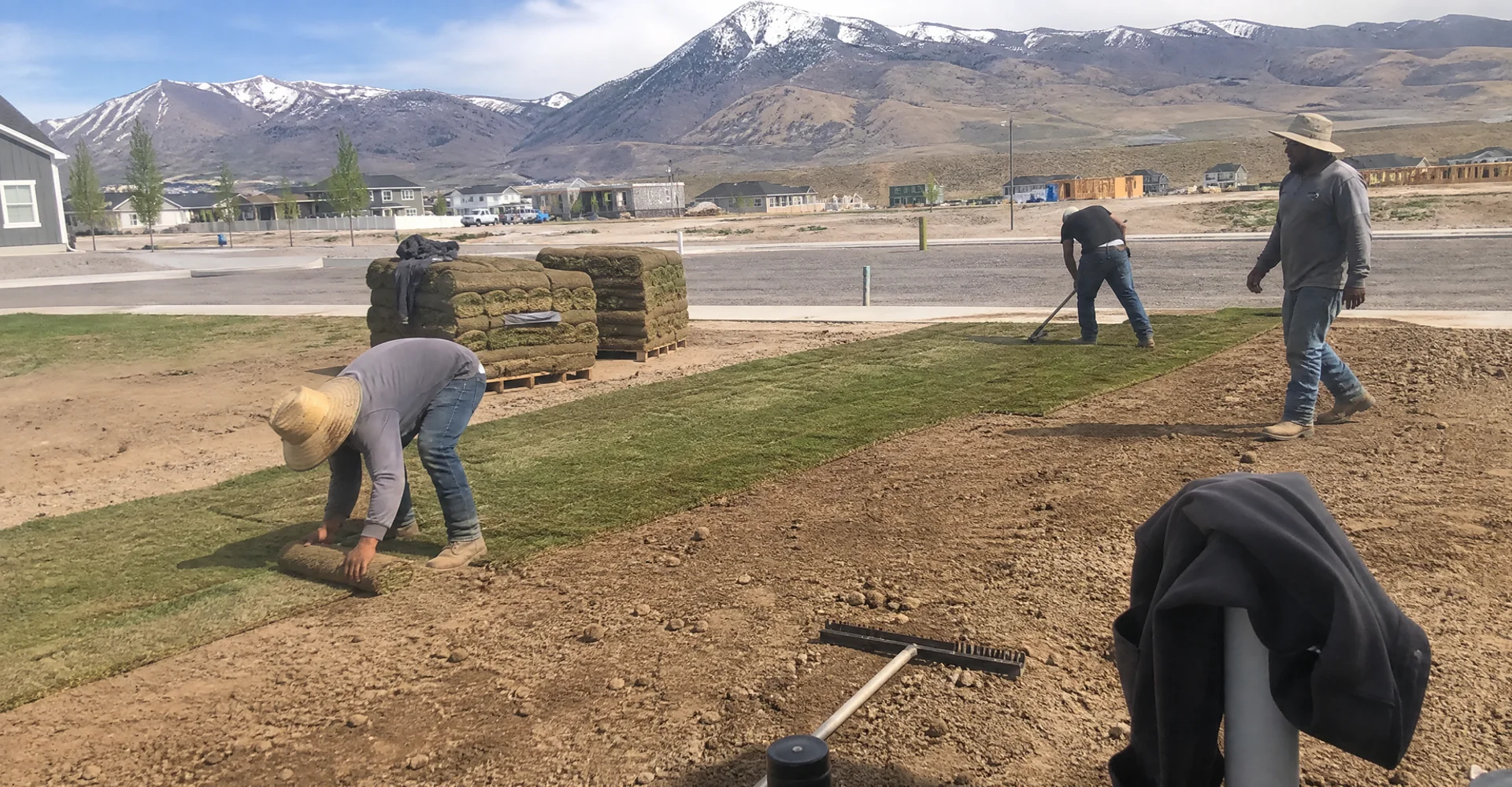 YLC Landscaping crew installing a full new-build yard on bare builder dirt in a Utah subdivision