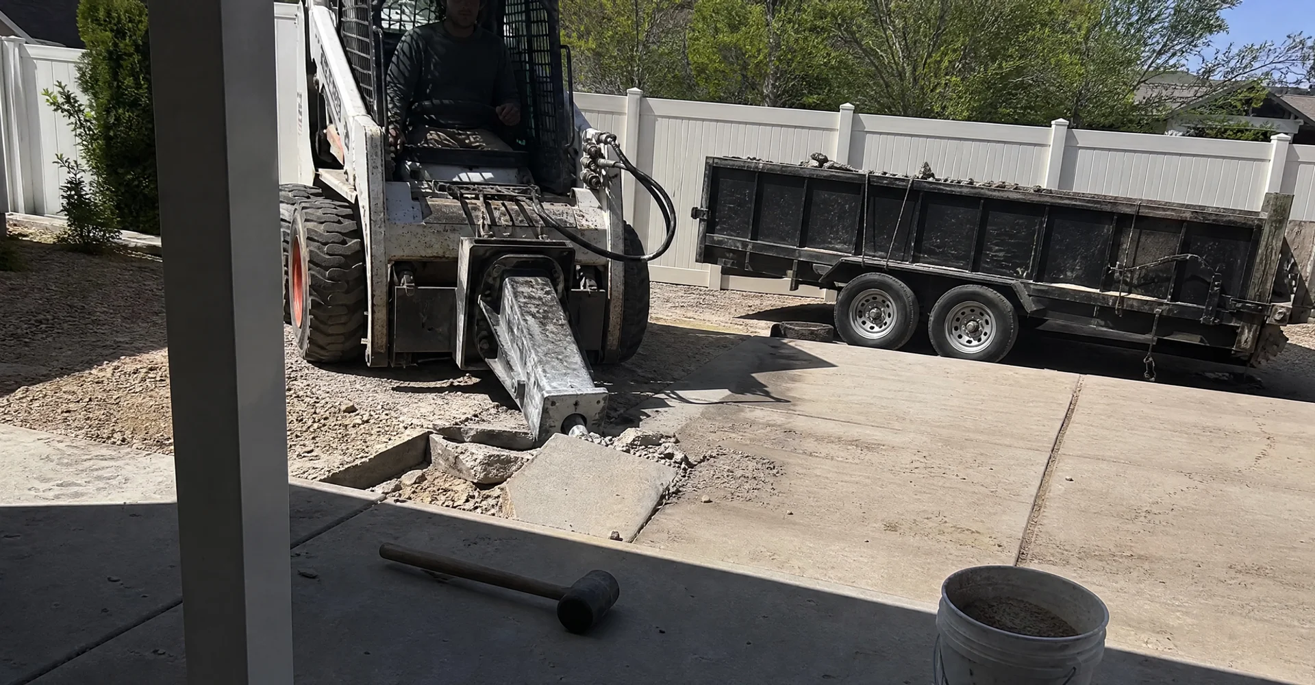 Old concrete patio being broken up and removed from a Utah back yard